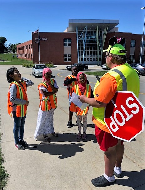 Elementary school patrol kids guarding the corners for safety. St